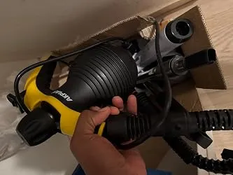 Steam cleaner being taken out of its box