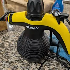 Close-up of the steam cleaner on a kitchen counter